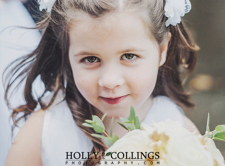 Bridesmaid at St Petrox Church Dartmouth before ceremony, photographed by Holly Collings Photography in Devon
