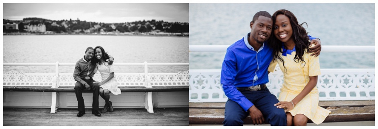 couple sat on torquay pier for couples photoshoot on their anniversary