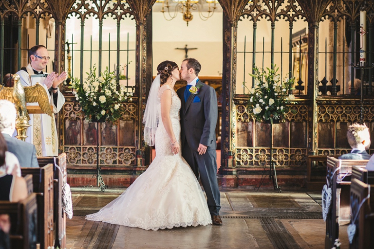 bride and groom kissing after church ceremony in dartmouth