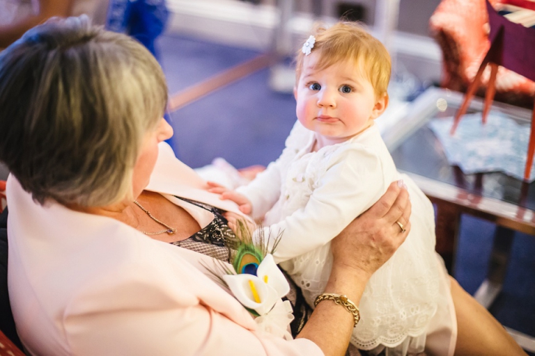 little girl with grandma at wedding reception at dartmouth castle