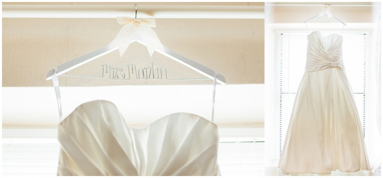 weddng dress hanging in window on personalised hanger