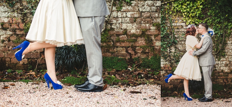 married couple kissing, bride lifting foot up in cockington court rose gardens, star crossed lovers eloping