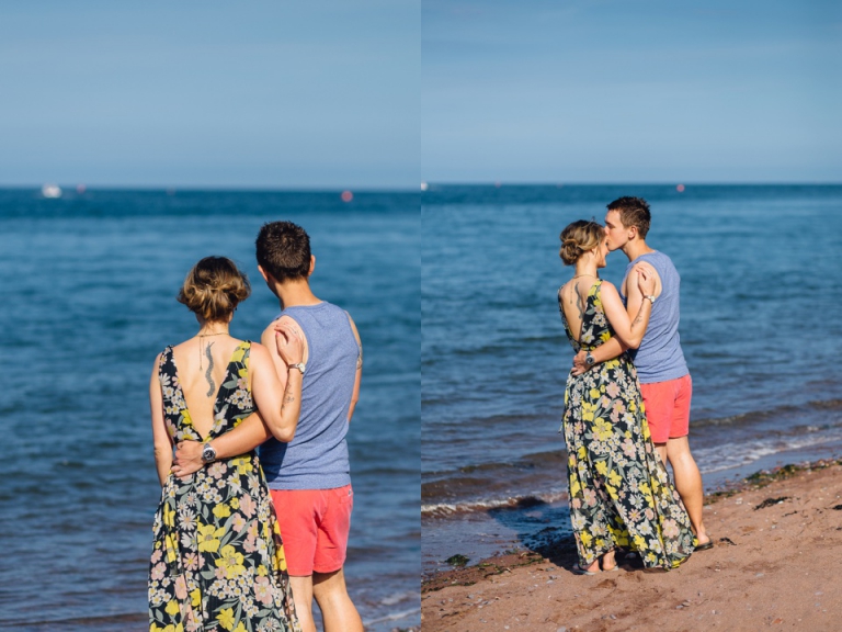 Pre wedding engagement portrait session in Shaldon, Torquay on beach and botanical gardens_ couple looking out to sea, man kissing womans forehead during sunset on beach