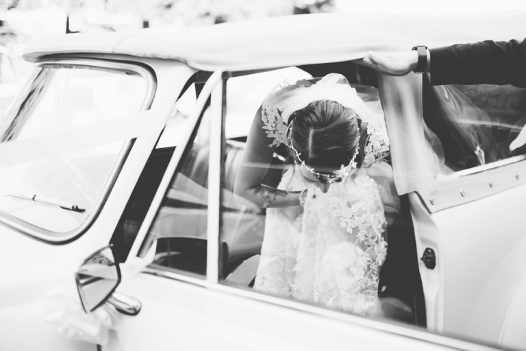 Vintage Wedding Photography at Redcliffe Hotel, Paignton_bride leaving Squires Wedding Car in Bridal Box dress and Bridal Rooms Headpiece