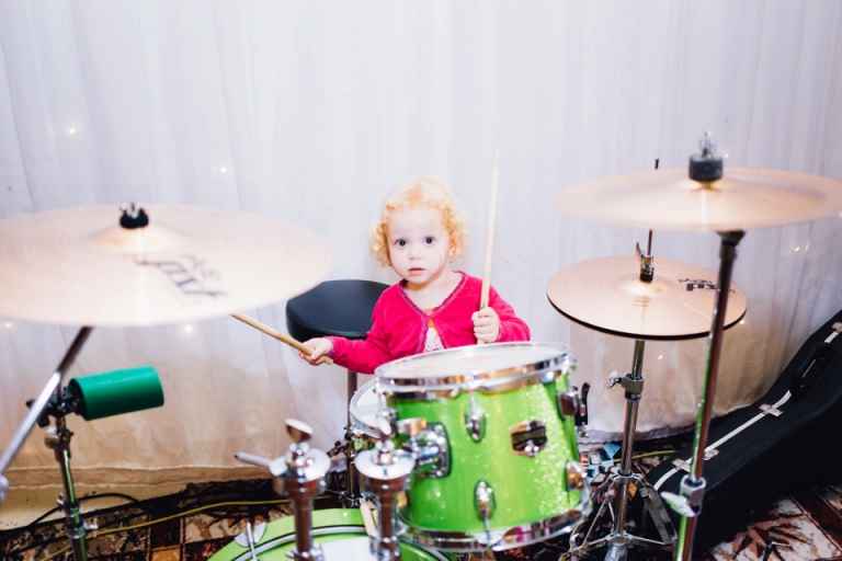 Best of wedding photography in Torquay, Paignton, London and Exeter - Natural, Candid, Photojournalistic - Toddler playing drums at reception