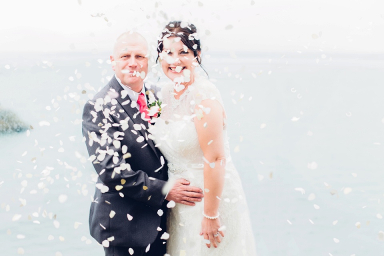 Best of wedding photography in Torquay, Paignton, London and Exeter - Natural, Candid, Photojournalistic couple being showered by confetti at living coasts