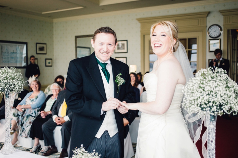 Best of wedding photography in Torquay, Paignton, London and Exeter - Natural, Candid, Photojournalistic couple grinning during ceremony at imperial hotel