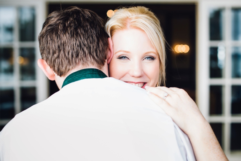 Best of wedding photography in Torquay, Paignton, London and Exeter - Natural, Candid, Photojournalistic bride with beautiful blue eyes looking over grooms shoulder