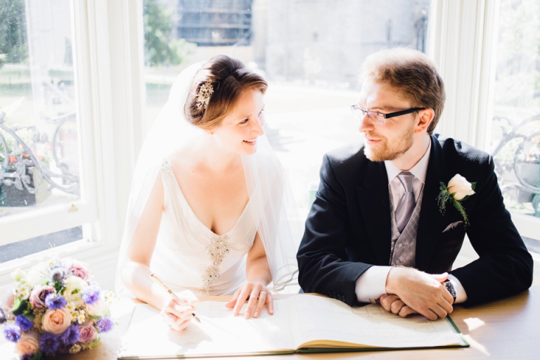 Best of wedding photography in Torquay, Paignton, London and Exeter - Natural, Candid, Photojournalistic - signing the register at abode exeter ceremony