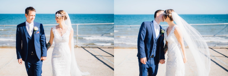 Intimate, Pastel Vintage Wedding Photography at Redcliffe Hotel, Paignton, Devon_bride and groom walking hand in hand and kissing, sea view