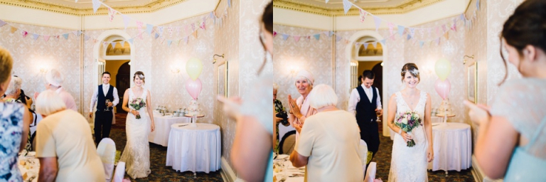 Intimate, Pastel Vintage Wedding Photography at Redcliffe Hotel, Paignton, Devon_bride and groom entering wedding breakfast to applause
