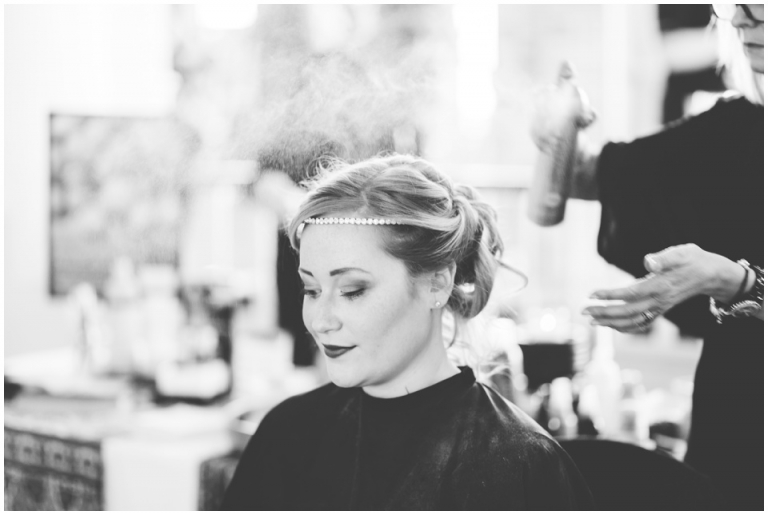 The Redcliffe Hotel Paignton Wedding Fair Photography - model having hair and makeup done, hairspray black and white