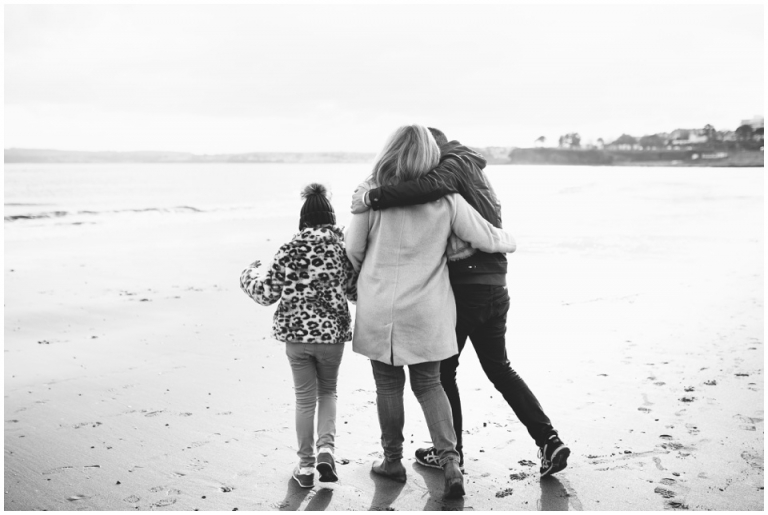 Torre Abbey Sands Torquay Family Photography_black and white family walking along beach