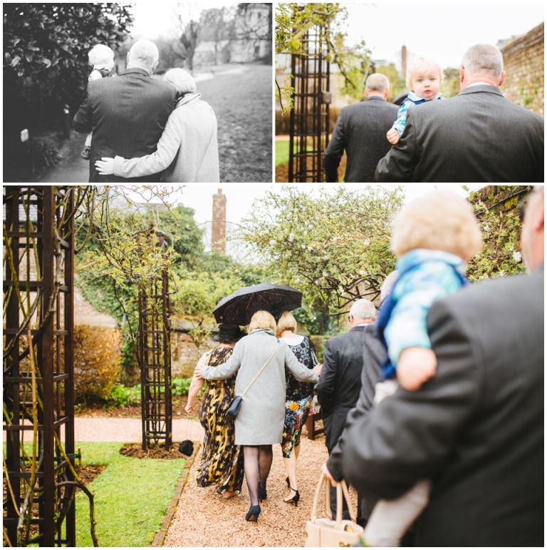 2 Small Intimate Cockington Court Wedding Photography in Torquay - guests walking to ceremony in the rain