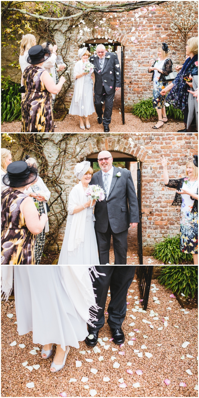 36 Small Intimate Cockington Court Wedding Photography in Torquay - confetti throw in rose garden