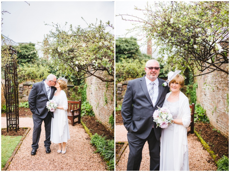 37 Small Intimate Cockington Court Wedding Photography in Torquay - just married couple in rose garden