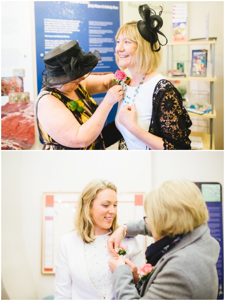 4 Small Intimate Cockington Court Wedding Photography in Torquay - guests putting on buttonholes