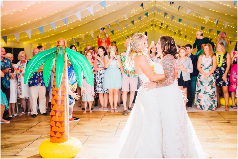 108 Blackpool Sands Dartmouth Wedding Photography Creative Documentary - brides first dance funny inflatable palm tree