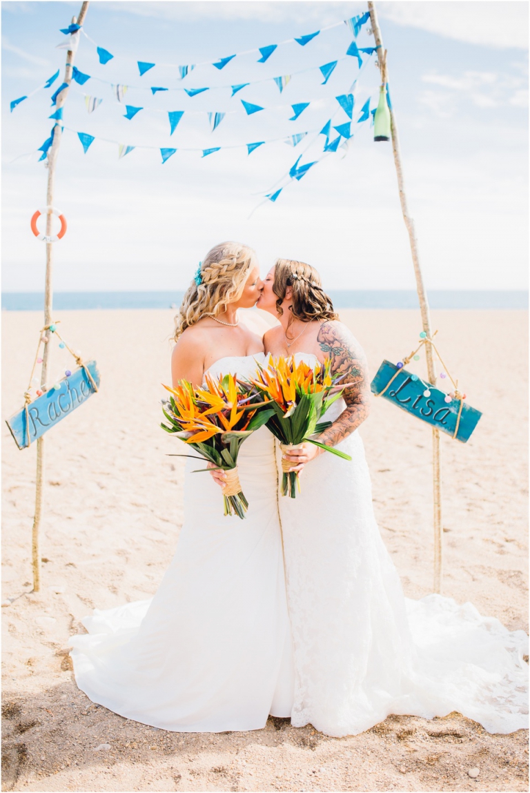 33 Blackpool Sands Dartmouth Wedding Photography Creative Documentary - ceremony kiss under home made nautical arch