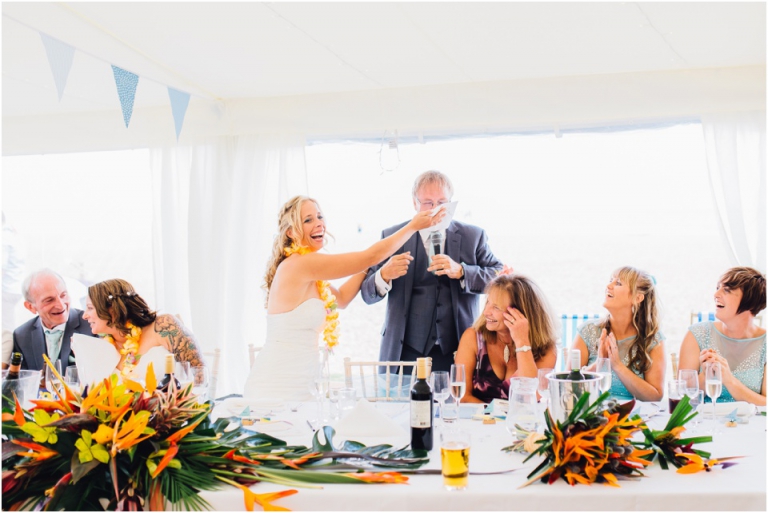 60 Blackpool Sands Dartmouth Wedding Photography Creative Documentary - bride gagging dad during speech