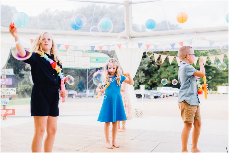 64 Blackpool Sands Dartmouth Wedding Photography Creative Documentary - children playing with bubbles at reception