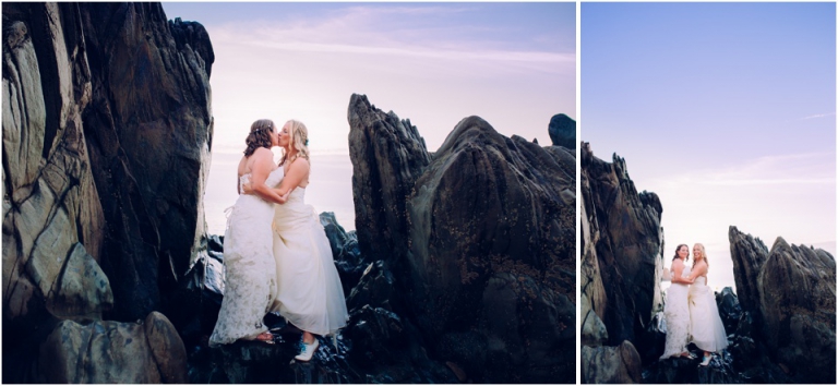 89 Blackpool Sands Dartmouth Wedding Photography Creative Documentary - brides standing on rocks kissing