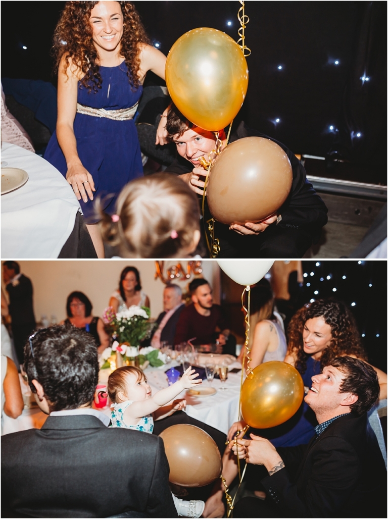 40 Wedding Reception Photography at The Flavel, Dartmouth - man playing with child and balloons