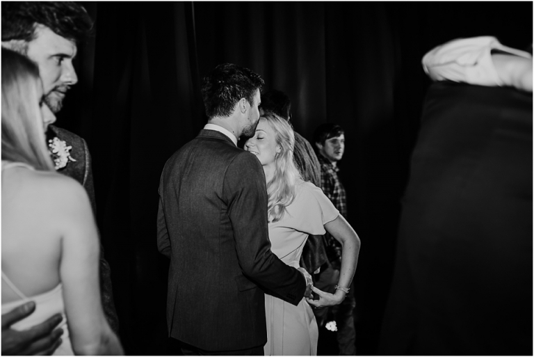 49 Wedding Reception Photography at The Flavel, Dartmouth - black and white dance floor couple kiss documentary style