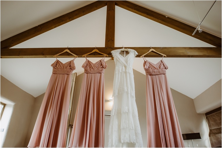 Cornwall Wedding Photography at Trevenna Barns Relaxed Rustic Outdoors Celebration (3) dresses hanging up